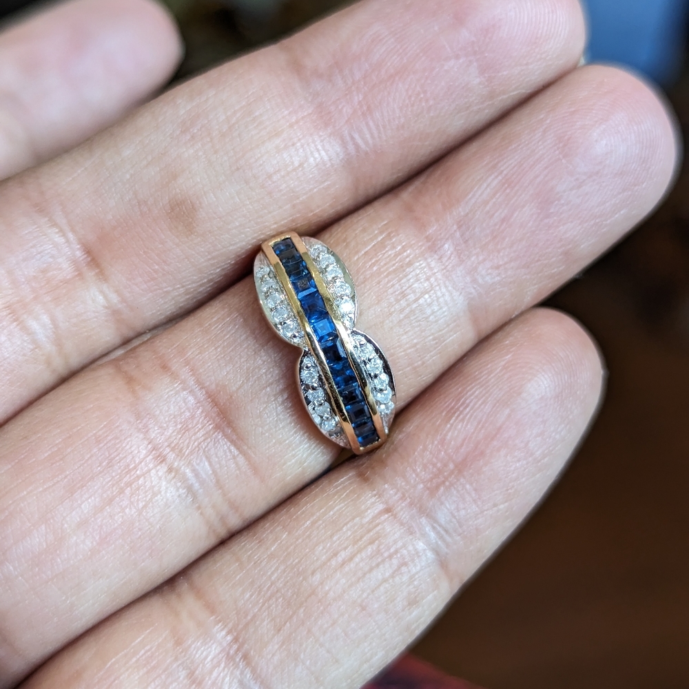 14k gold ring with natural diamonds and natural sapphire.